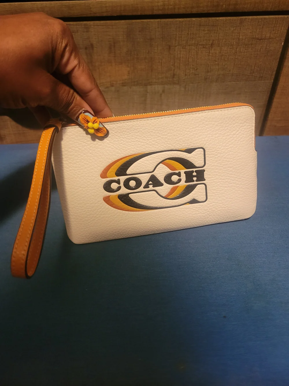 COACH Cream Leather Wristlet with Orange Trim